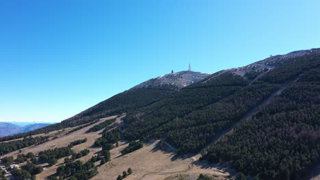 Mont-Ventoux-north-side-summit-aerial-shot-fir-trees-sunny-day-blue-sky-Vaucluse